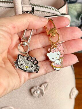 NEW 2-Pc Hello Kitty Keychain Silver Rhinestone & Goldtone Cupid with Bow Charms